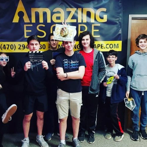group of young people solving the escape game